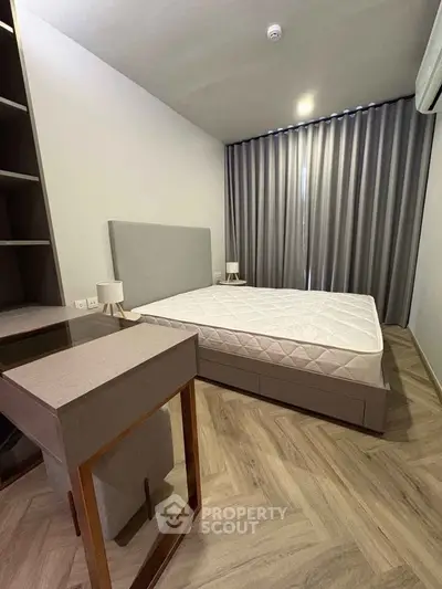 Modern bedroom with stylish furniture and elegant flooring