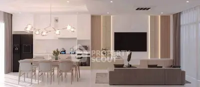 Luxurious open-plan living room with modern kitchen, elegant lighting, and sleek decor.
