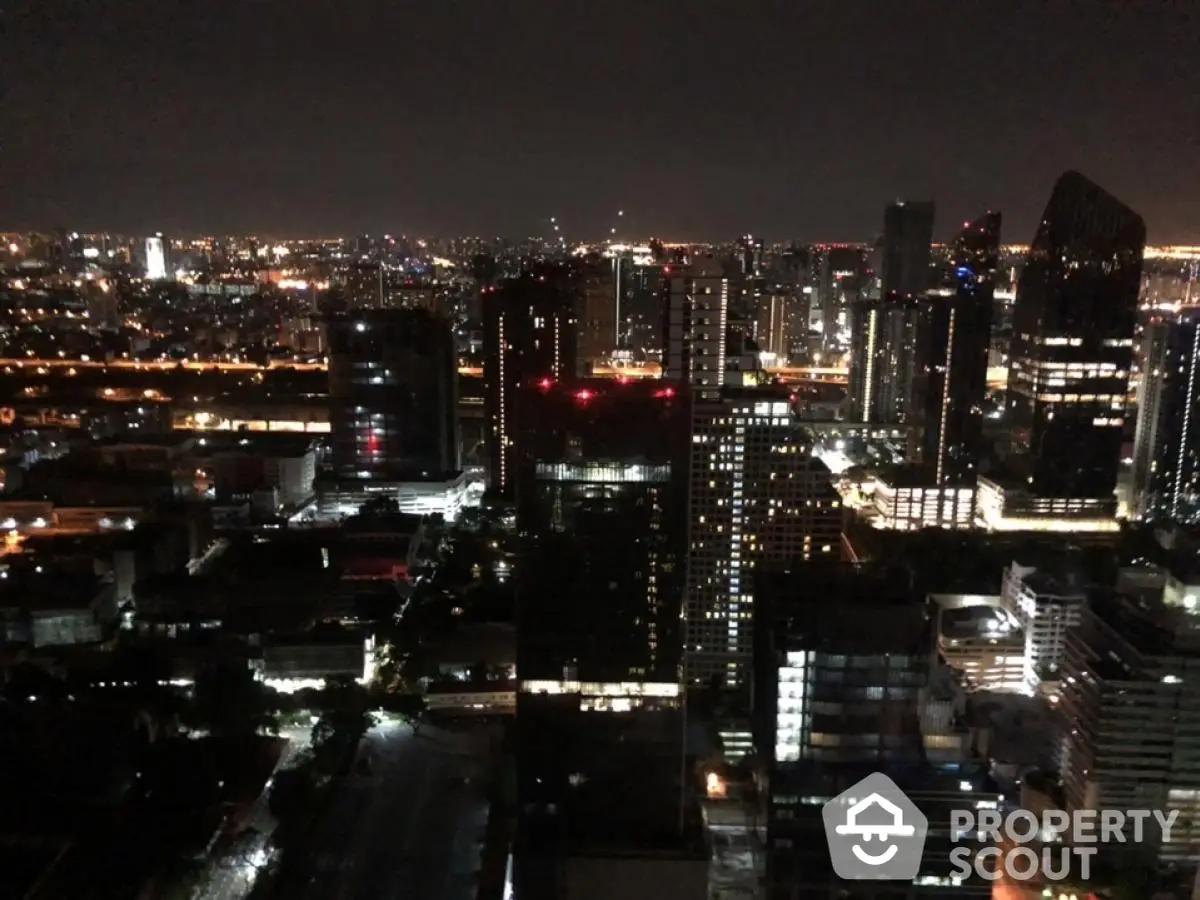 Stunning city skyline view at night with illuminated skyscrapers and vibrant urban landscape.