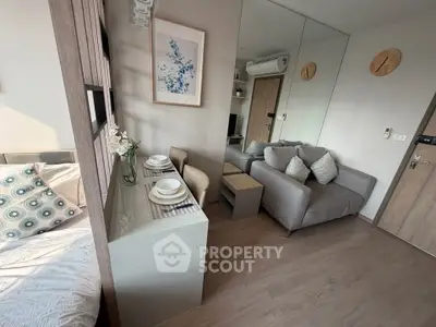 Modern studio apartment with cozy living area and stylish decor