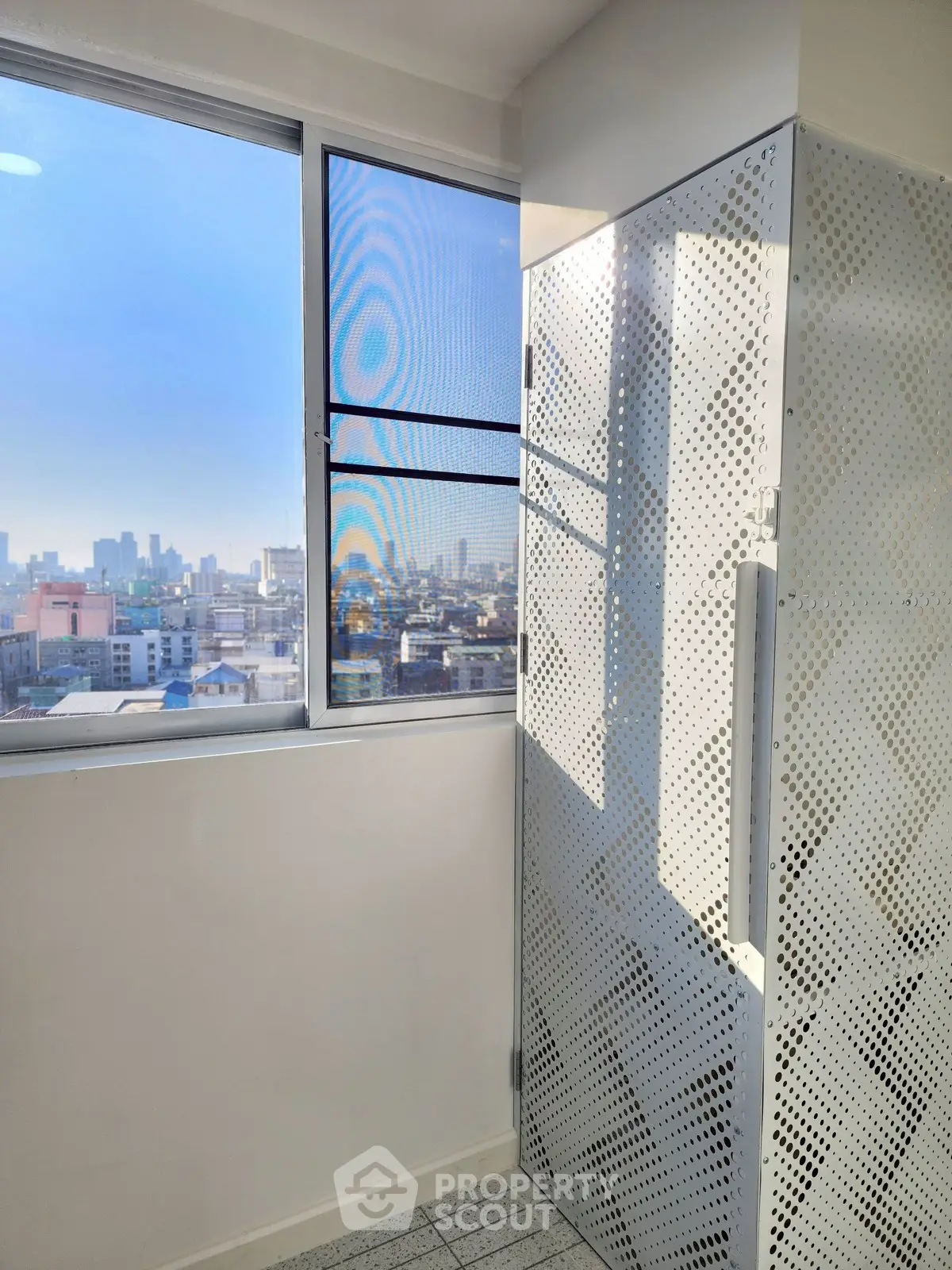 Modern apartment with city view and stylish metal paneling