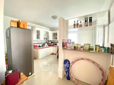 Spacious kitchen with modern appliances and ample storage space, perfect for culinary enthusiasts.