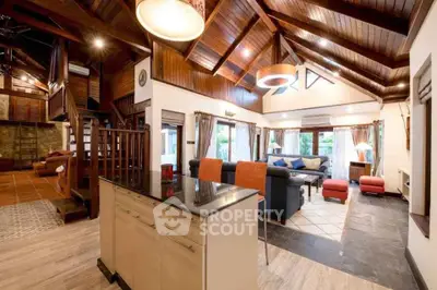 Spacious living room with high wooden ceilings and modern decor