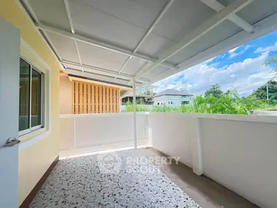 Spacious balcony with modern design and scenic view in a residential property.