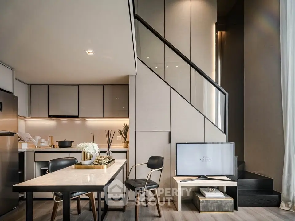 Modern duplex apartment with sleek kitchen and stylish dining area