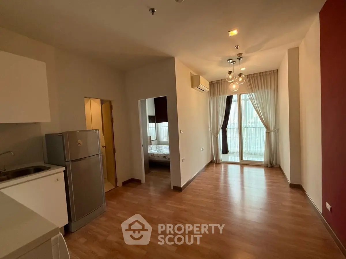 Spacious open-plan apartment with modern kitchen and large windows
