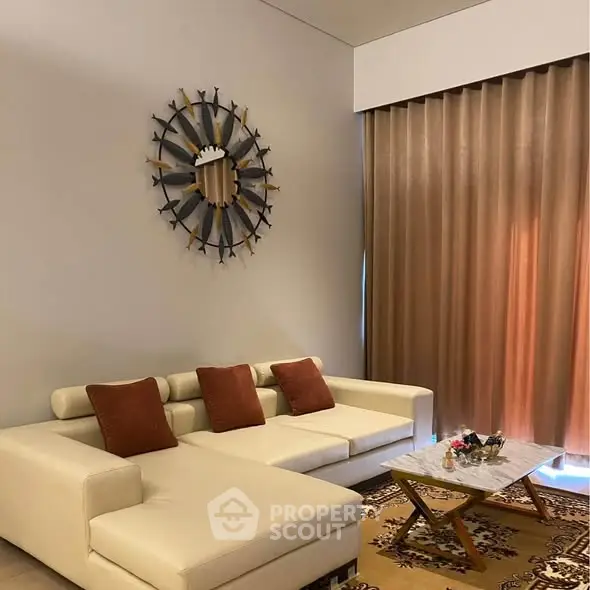 Elegant living room with white sectional sofa and decorative wall art