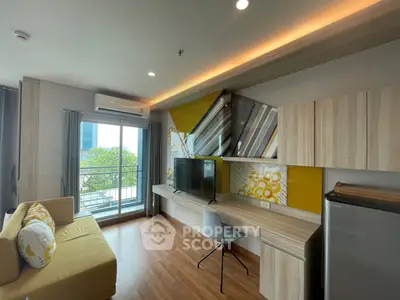 Modern living room with stylish decor, large window, and balcony access in a contemporary apartment.