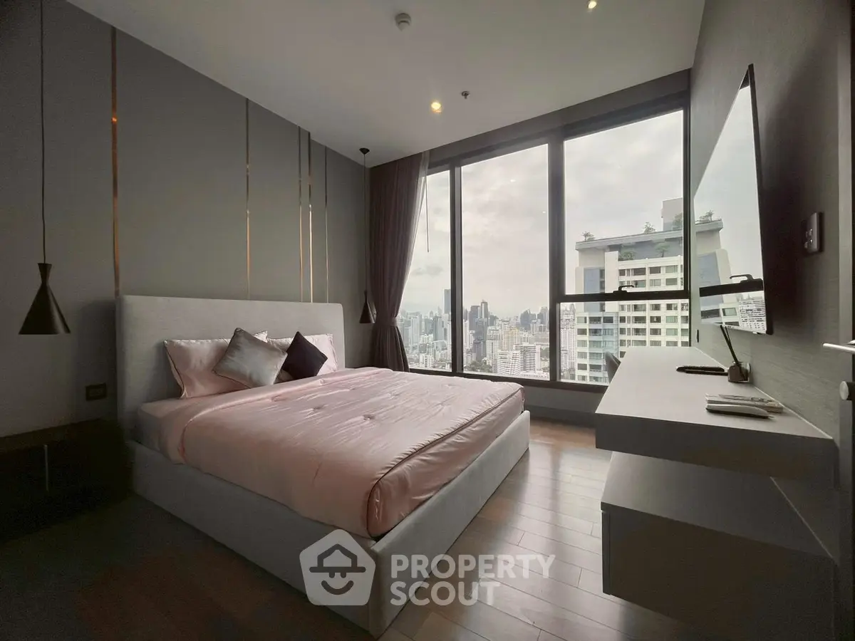 Luxurious bedroom with stunning city view and modern decor