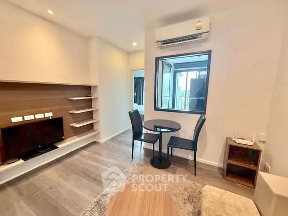 Modern living room with air conditioning and stylish furniture in a cozy apartment.
