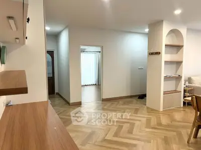 Spacious modern living room with stylish wooden flooring and open layout