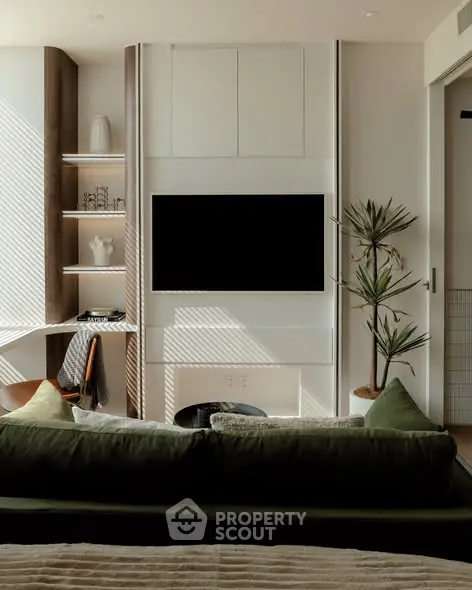 Modern living room with stylish decor and built-in TV unit