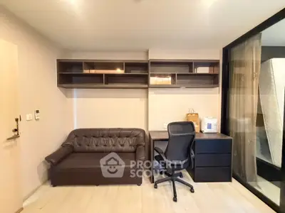 Modern study room with sleek desk, comfortable chair, and stylish shelving in a cozy apartment.