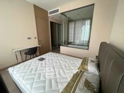 Modern bedroom with glass partition and minimalist design in luxury apartment