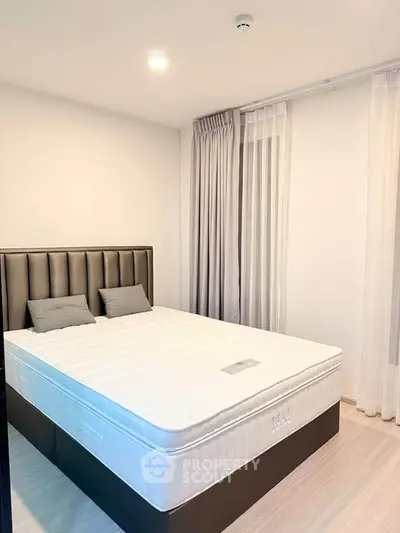 Modern bedroom with elegant decor and natural light