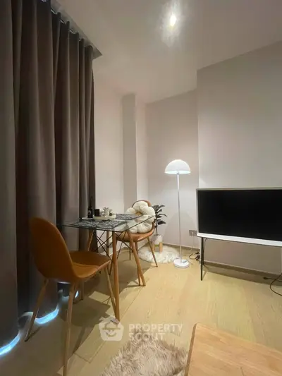 Cozy modern living room with stylish furniture and ambient lighting, perfect for relaxation and entertainment.