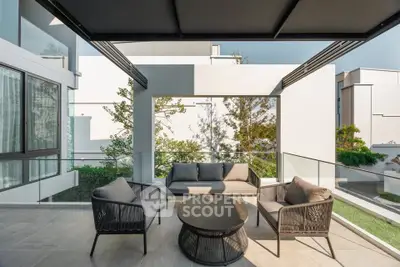 Luxurious modern balcony with stylish outdoor seating and scenic view