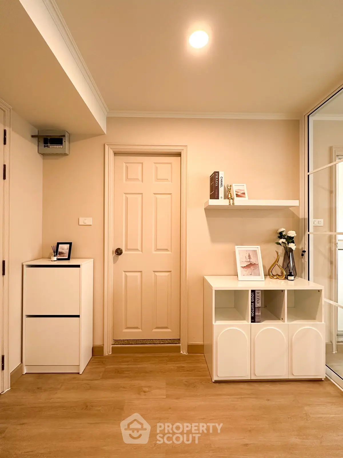 Modern interior with stylish shelving and warm lighting in a cozy living space.