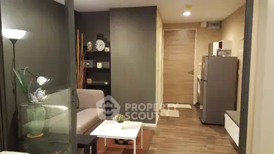 Modern apartment interior with stylish decor and open layout, featuring a cozy living area and contemporary furnishings.