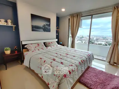 Modern bedroom with city view and floral bedding in high-rise apartment
