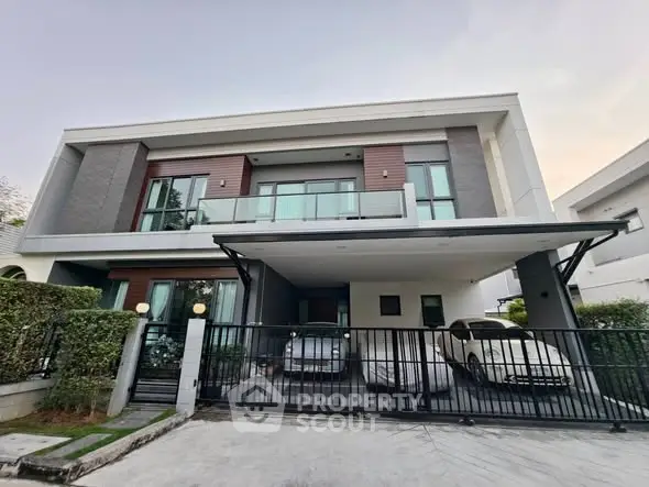 Modern two-story house with spacious driveway and sleek design