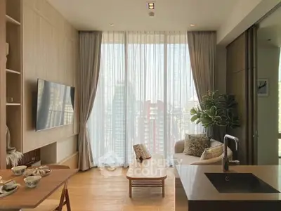 Modern living room with large windows and city view, featuring stylish decor and open layout.