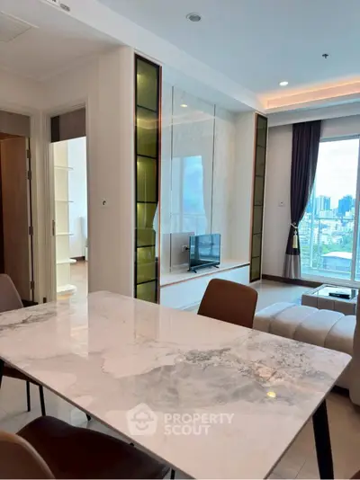 Modern living room with marble dining table and city view from large window.