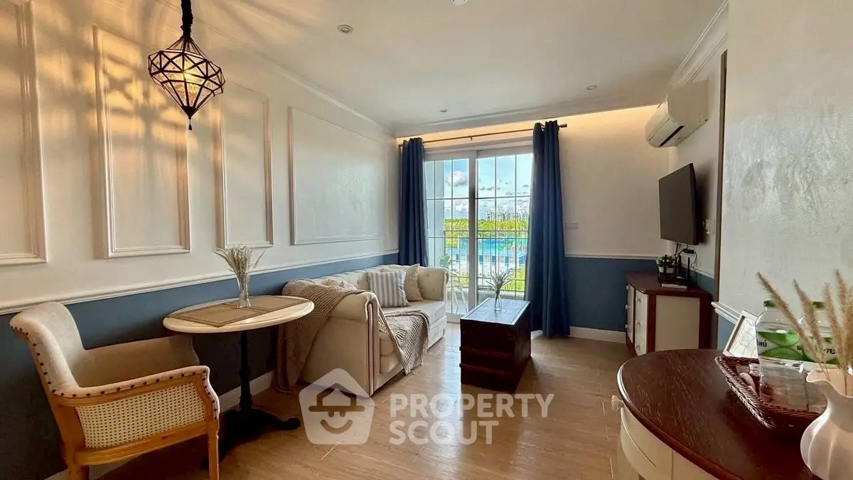 Charming living room with elegant decor and natural light, featuring a cozy seating area and stylish lighting.