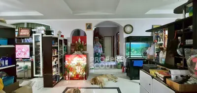 Spacious living room with aquarium and modern decor, featuring a cozy atmosphere and ample storage space.