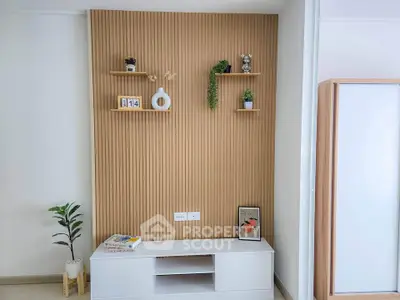 Modern minimalist living room with stylish wall decor and shelving