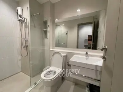 Modern bathroom with glass shower and sleek fixtures