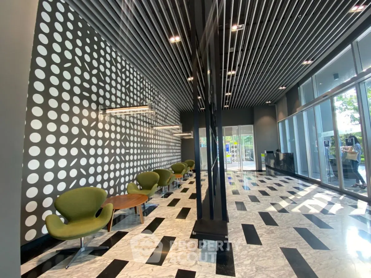 Modern building entrance with stylish decor and seating area