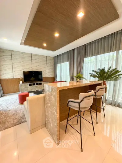 Modern living room with stylish bar counter and cozy seating area