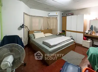 Cozy bedroom with modern furnishings and ample storage space