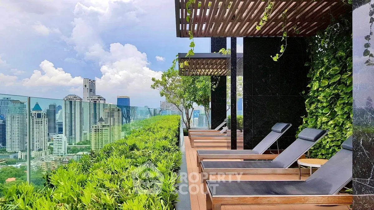 Luxurious rooftop terrace with stunning city skyline views and lush greenery.