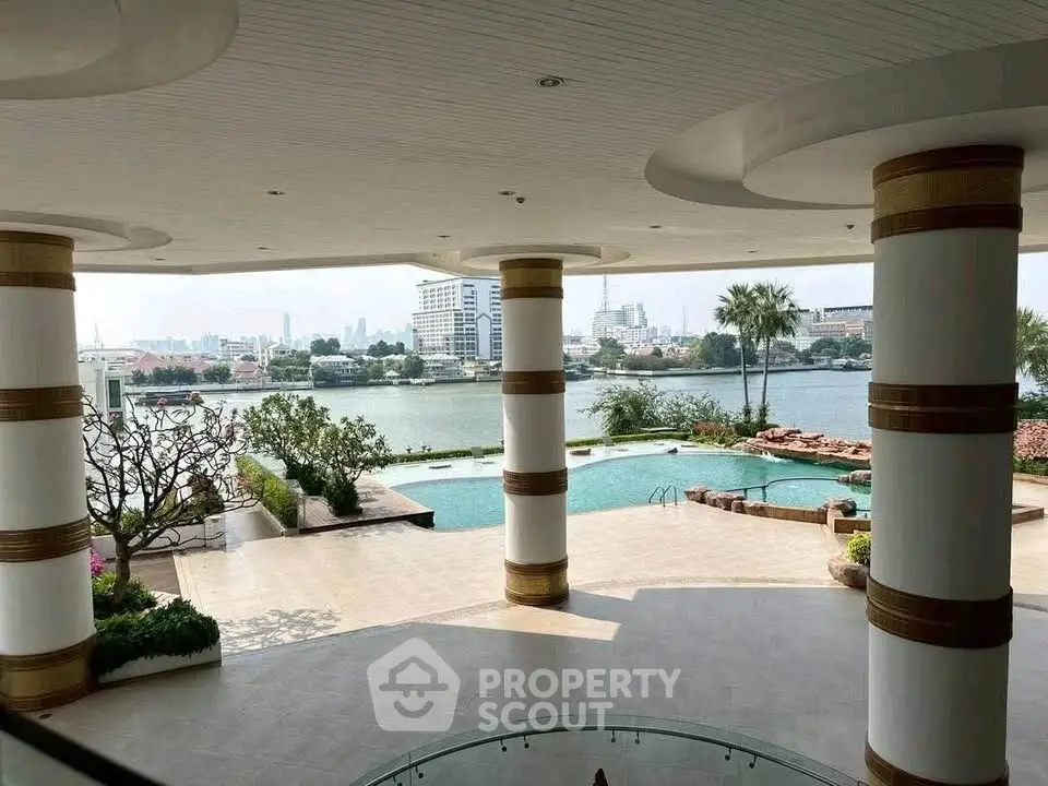 Luxurious riverside view with pool and lush garden in upscale property