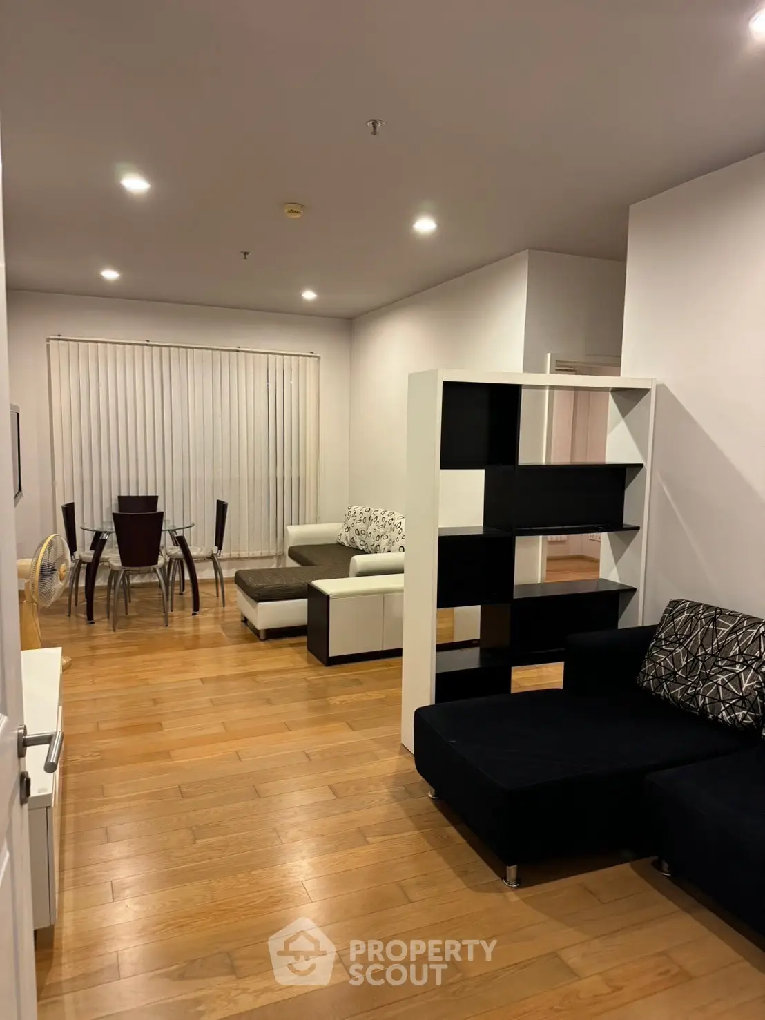 Spacious modern living room with elegant dining area and stylish furniture