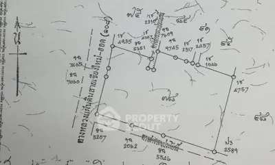 Detailed schematic plan of a property with measurements and annotations.