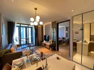 Modern open-plan living room with stylish decor and balcony view