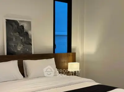 Cozy modern bedroom with stylish decor and ambient lighting