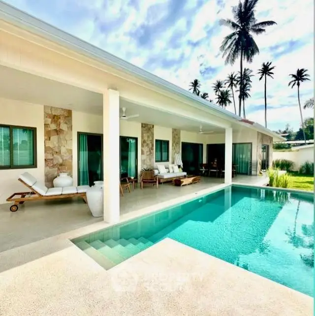 Luxurious tropical villa with private pool and spacious patio, perfect for relaxation and entertaining.