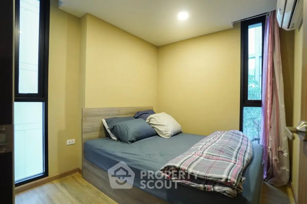 Cozy bedroom with modern decor and natural light
