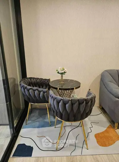 Elegant modern living room with plush chairs and stylish decor