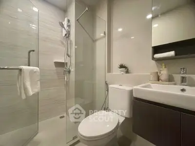 Modern bathroom with glass shower and sleek fixtures