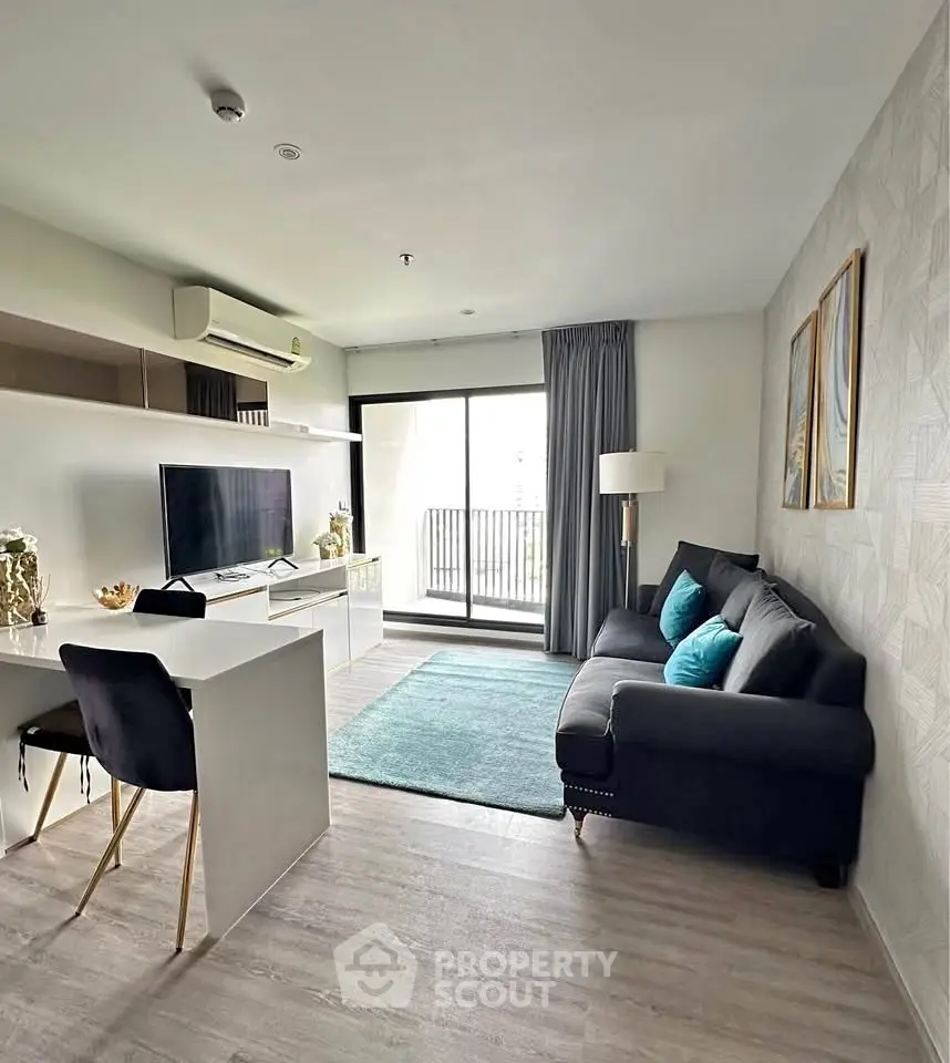 Modern living room with stylish decor and balcony view