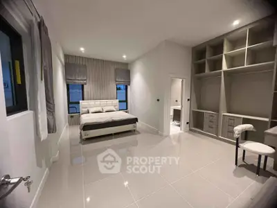 Spacious modern bedroom with built-in storage and elegant decor
