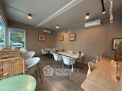 Chic modern dining area with stylish seating and ambient lighting, perfect for entertaining guests.