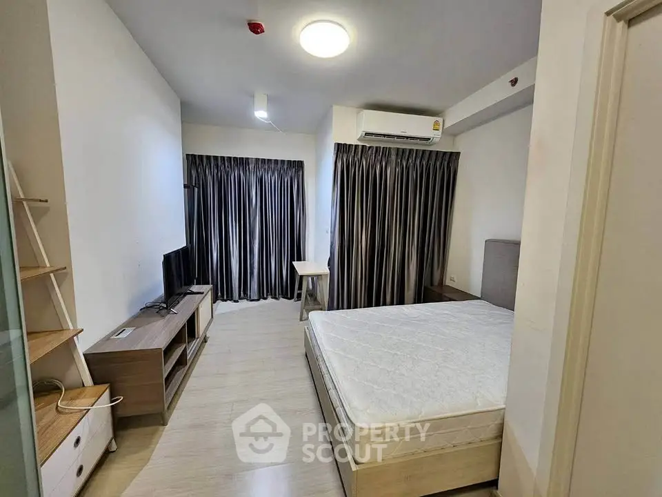 Modern bedroom with sleek furniture and natural light