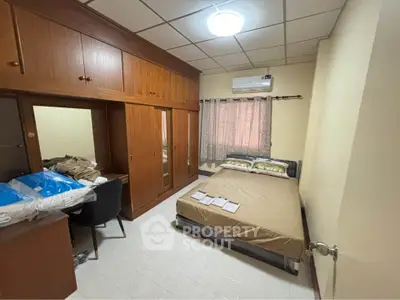 Cozy bedroom with built-in wardrobe and air conditioning, perfect for comfort and convenience.