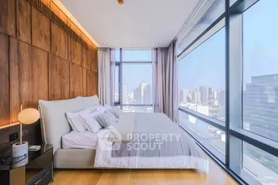 Luxurious bedroom with panoramic city view and modern decor